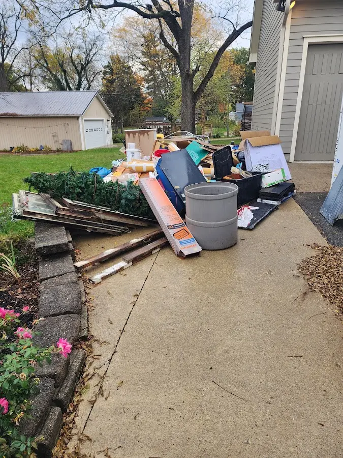 Dumpster being loaded with debris for Commercial Dumpster Rental in Kings Mountain